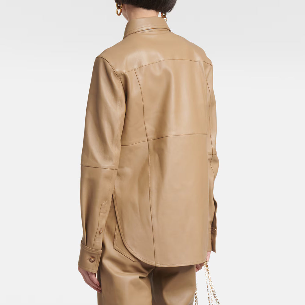 Tan leather jacket worn by a person on a white background