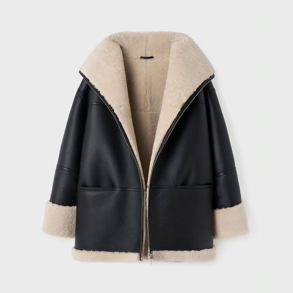 Black leather jacket with beige shearling collar and cuffs on a white background