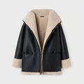 Black leather jacket with beige shearling collar and cuffs on a white background