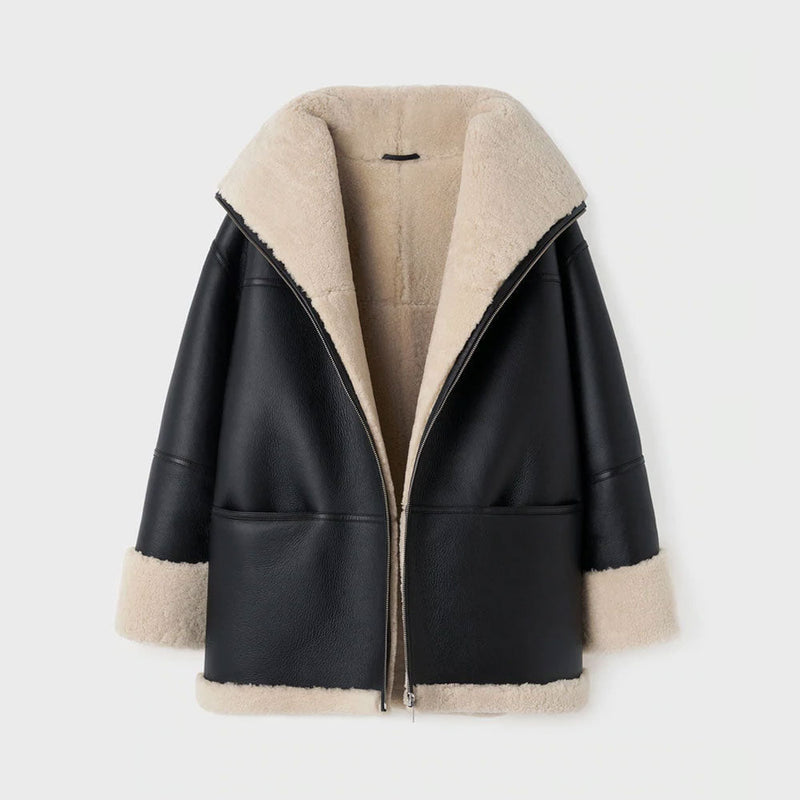 Black leather jacket with beige shearling collar and cuffs on a white background