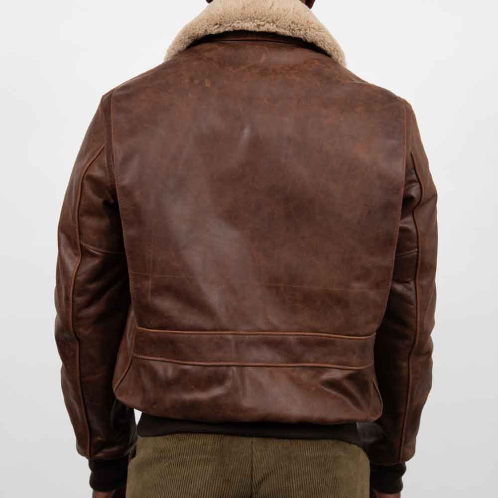 Brown leather jacket with fur collar on a white background