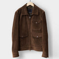 brown suede jacket hanging on hanger