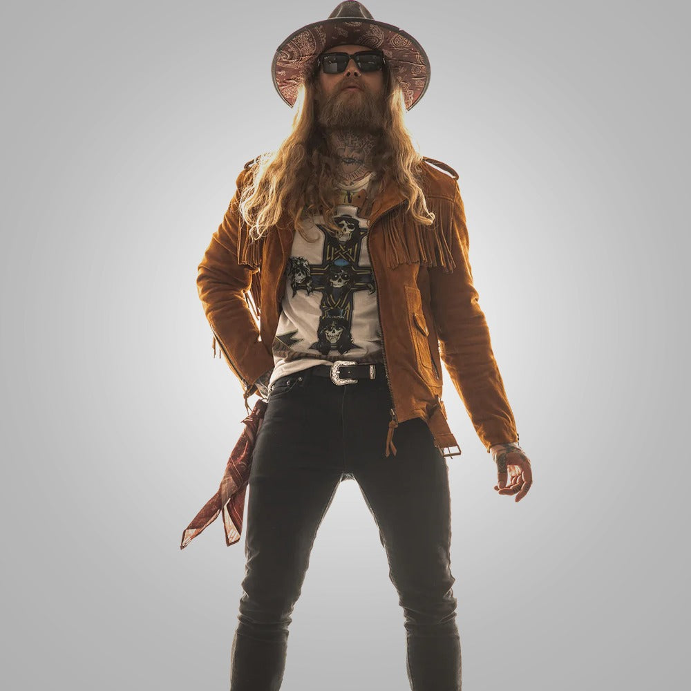 Man wearing a brown leather jacket, hat, and sunglasses on a gray background