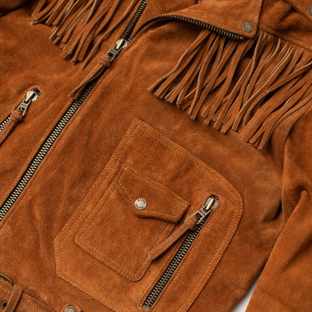 Close-up of a brown suede fringe jacket showing the chest pocket, zipper, and fringed neckline details.