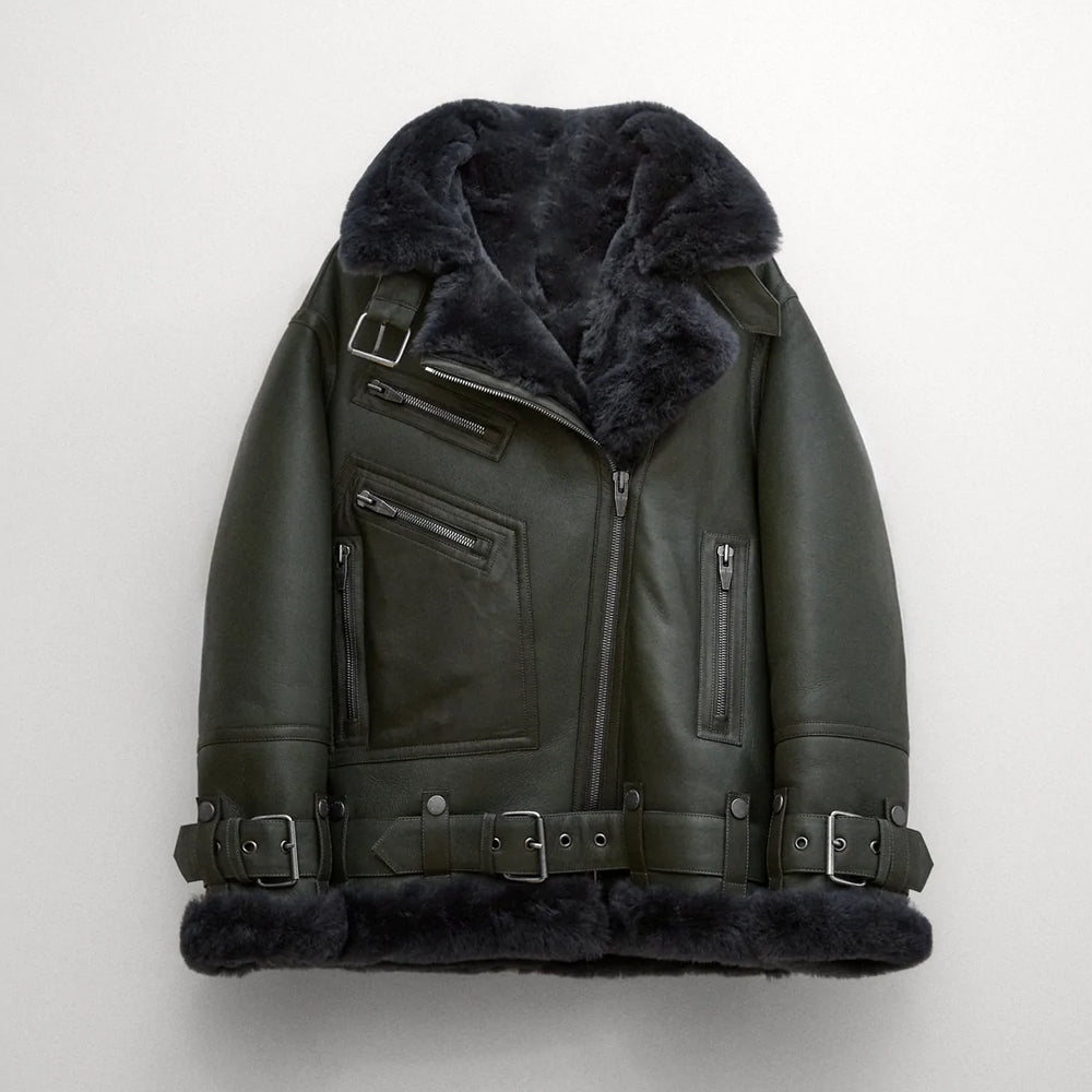 Green leather jacket with fur lining on a white background